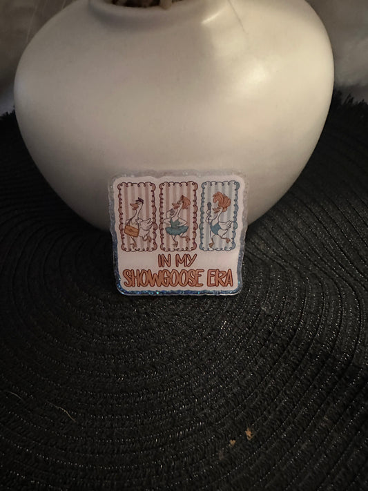Showgoose Era Badge Reel / Pop socket Topper
